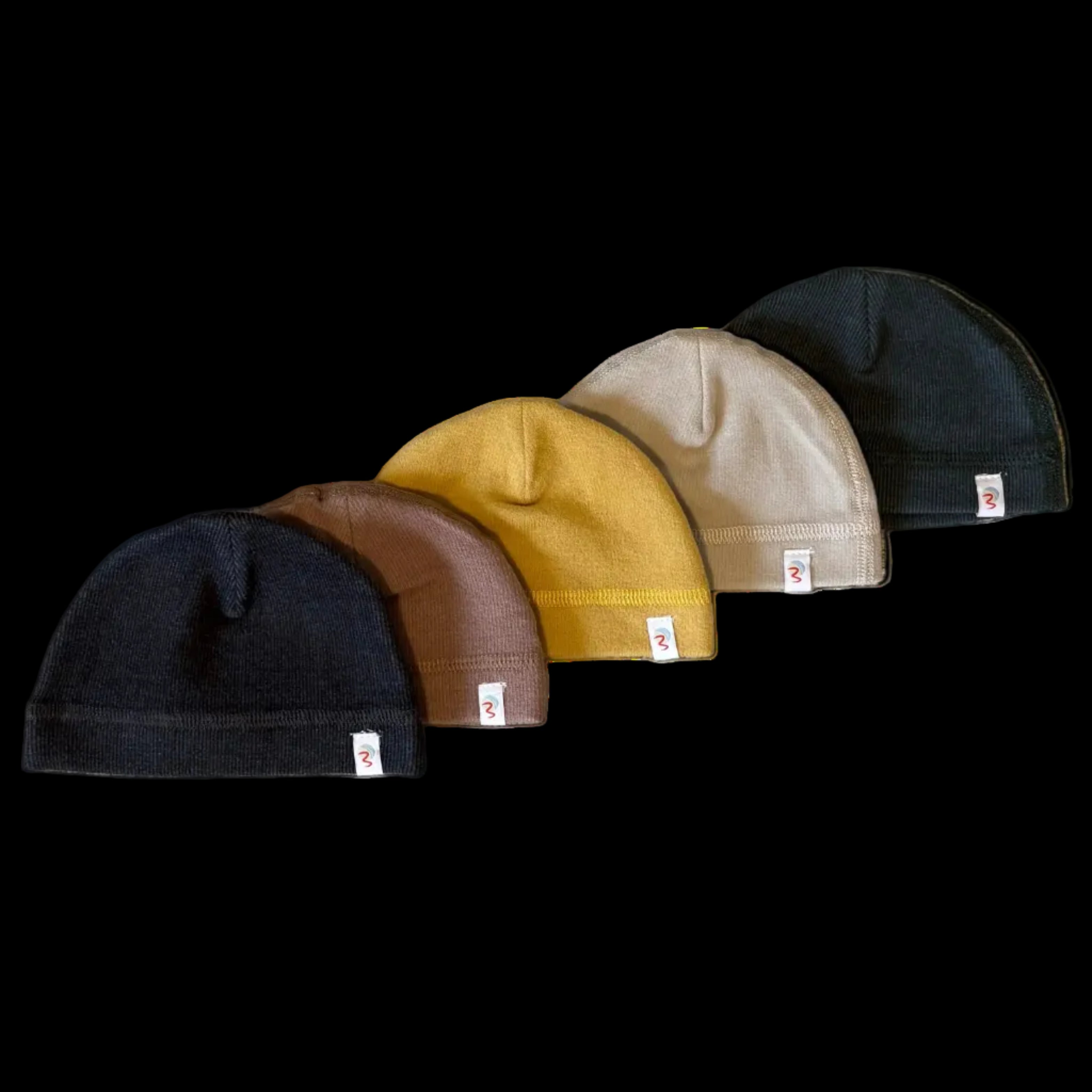 Five beanies in black, brown, yellow, beige, and navy arranged in a row on a black background.