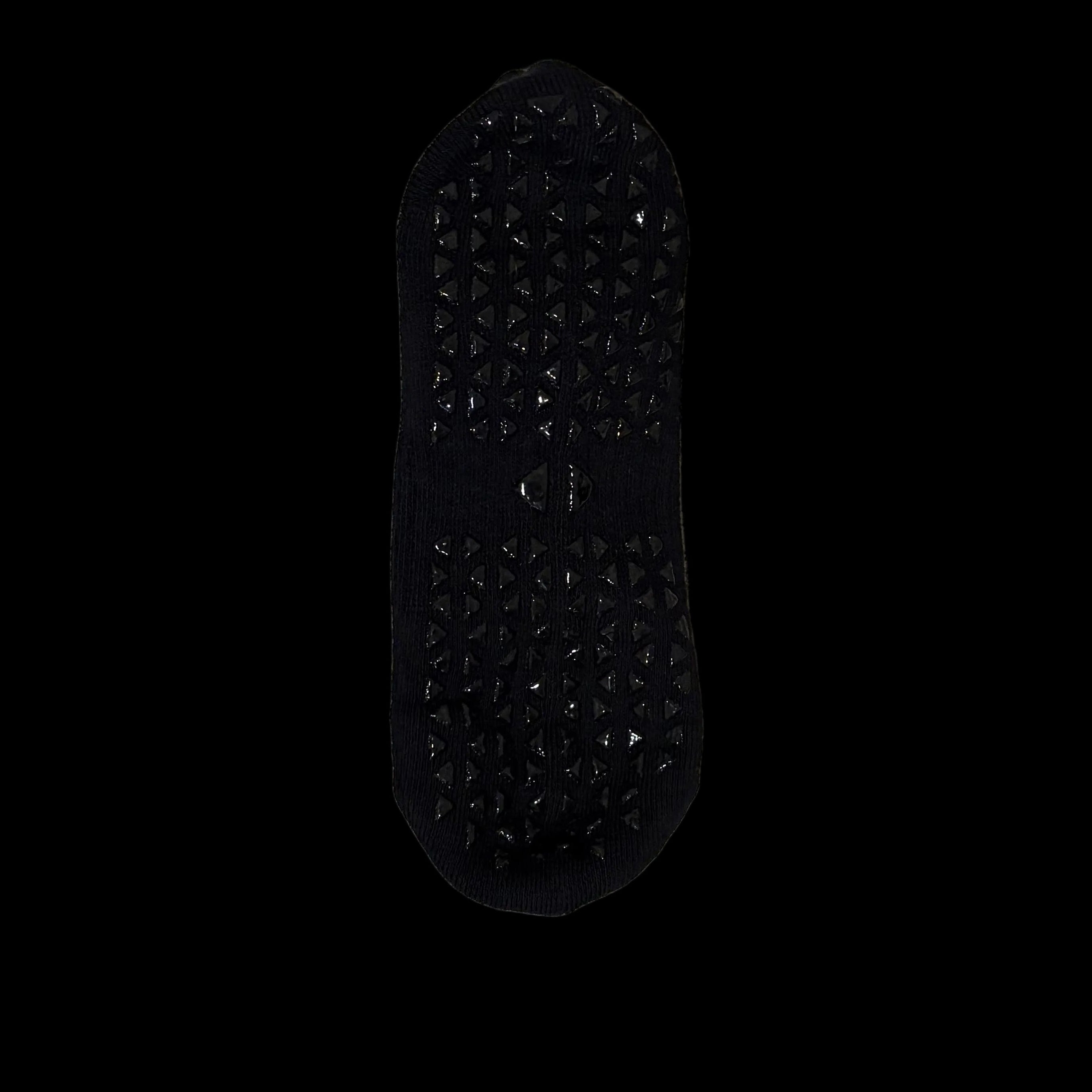 Black yoga socks, triangular plastic grips on sole of sock